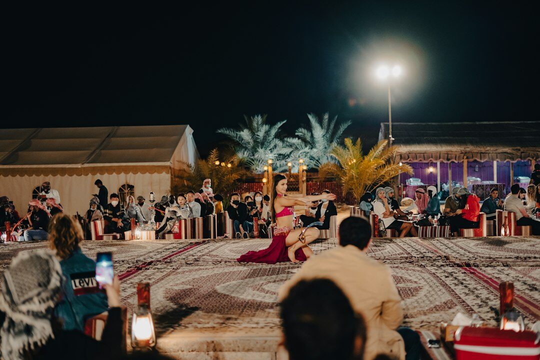 Photographers and press covering a red carpet event at night